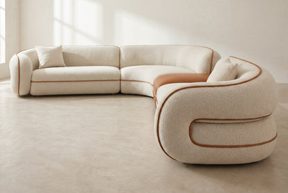 Anello sofa side view showing the looped arm and contrast piping