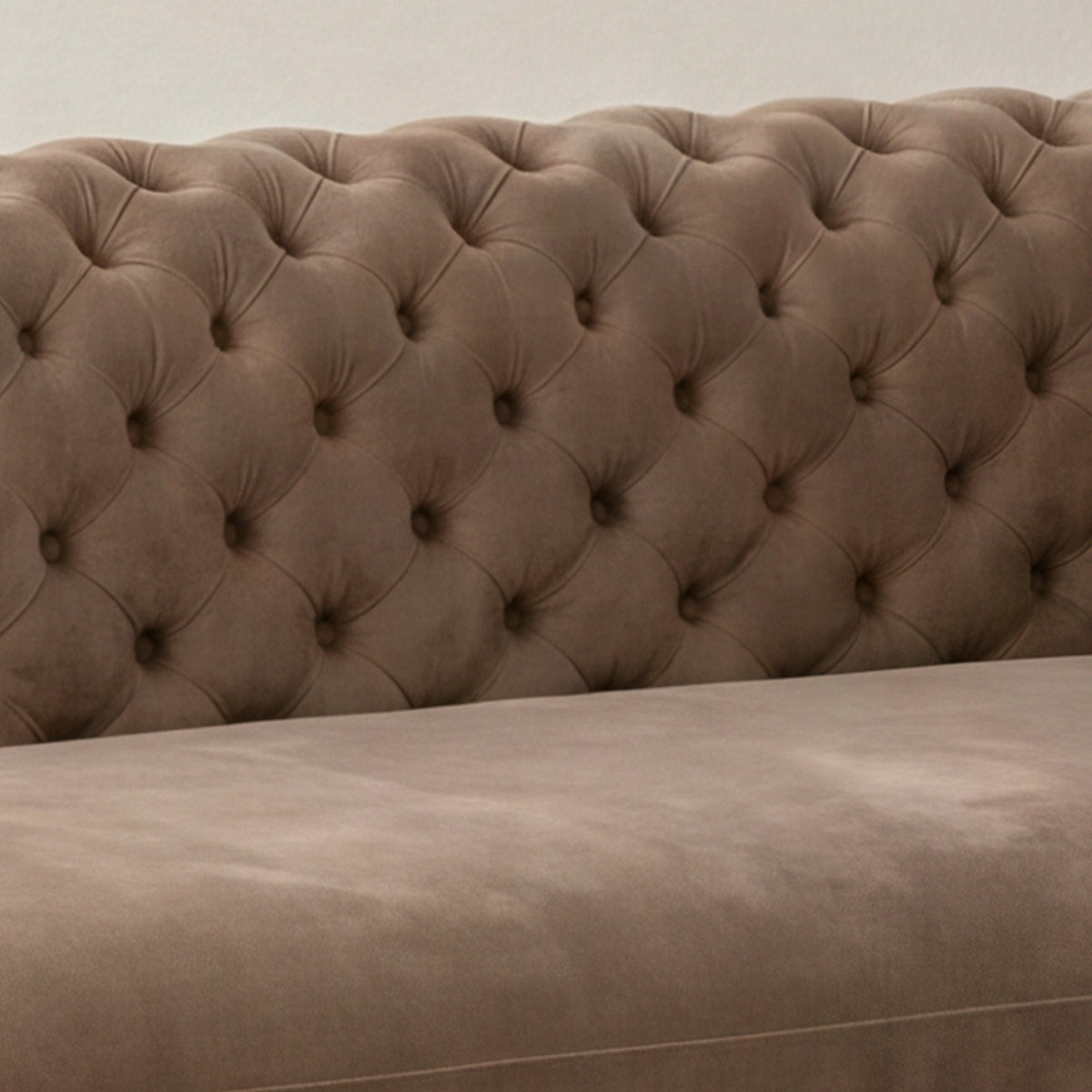 Close-up of the diamond tufted back and velvet seat cushion on the Palazzo sofa