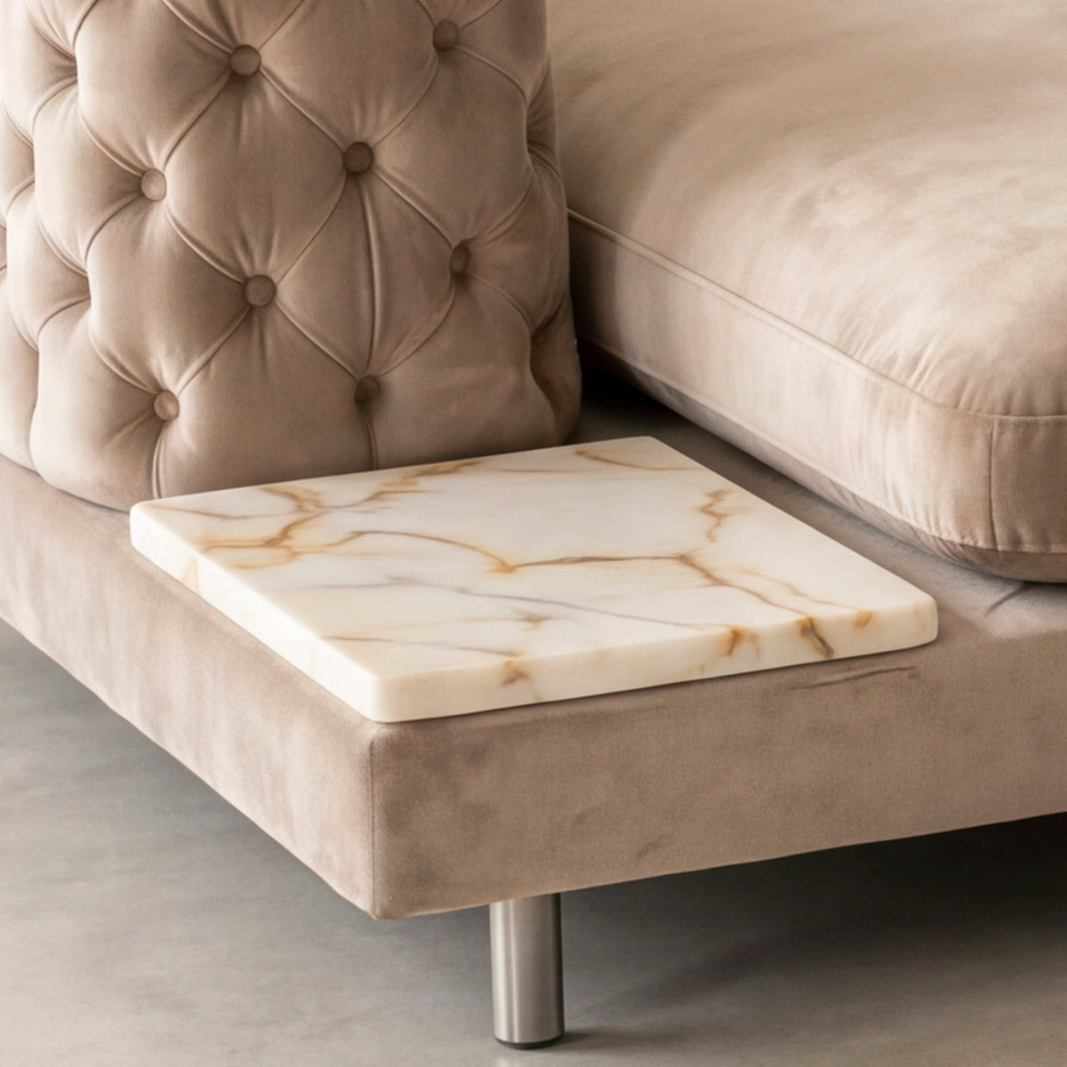 Close-up of the Calacatta Gold marble side table on the Palazzo chaise