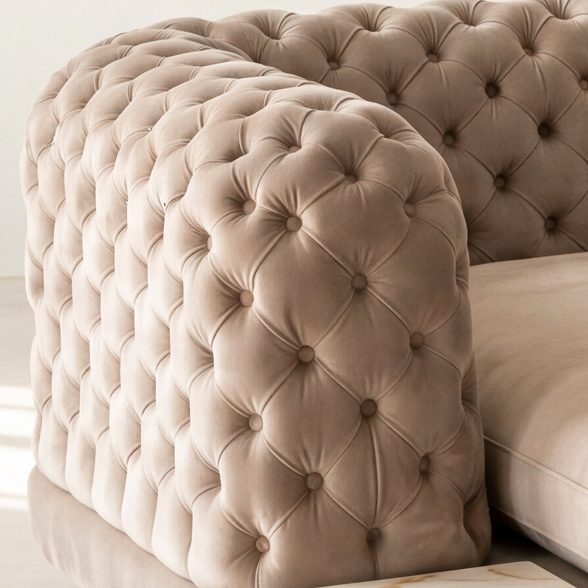Close-up of the tufted velvet arm on the Palazzo chaise