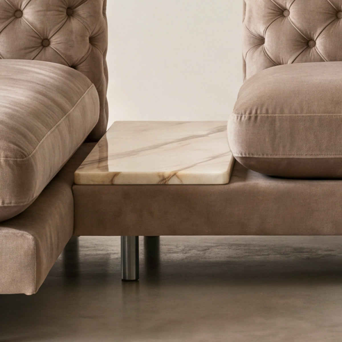 Close-up of the marble side table between the Palazzo sofa and chaise