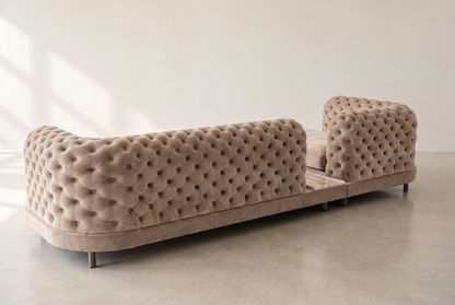 Palazzo sofa back view at an angle, fully tufted velvet back