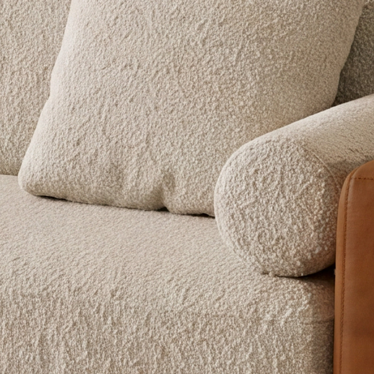 Close-up of the scatter cushion and bolster on the Sella sofa