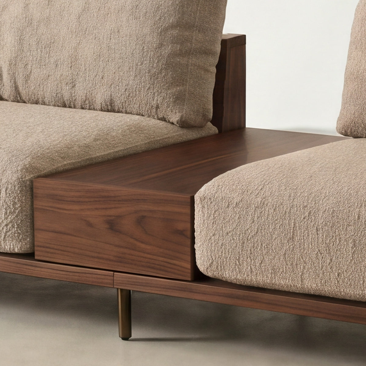 Close-up of the walnut-finish centre table on the Cornice sofa