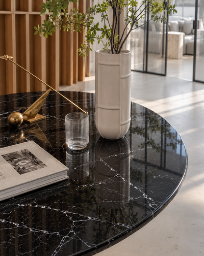 Close-up of the white veining on the polished Dominio Black Marquina marble round table top