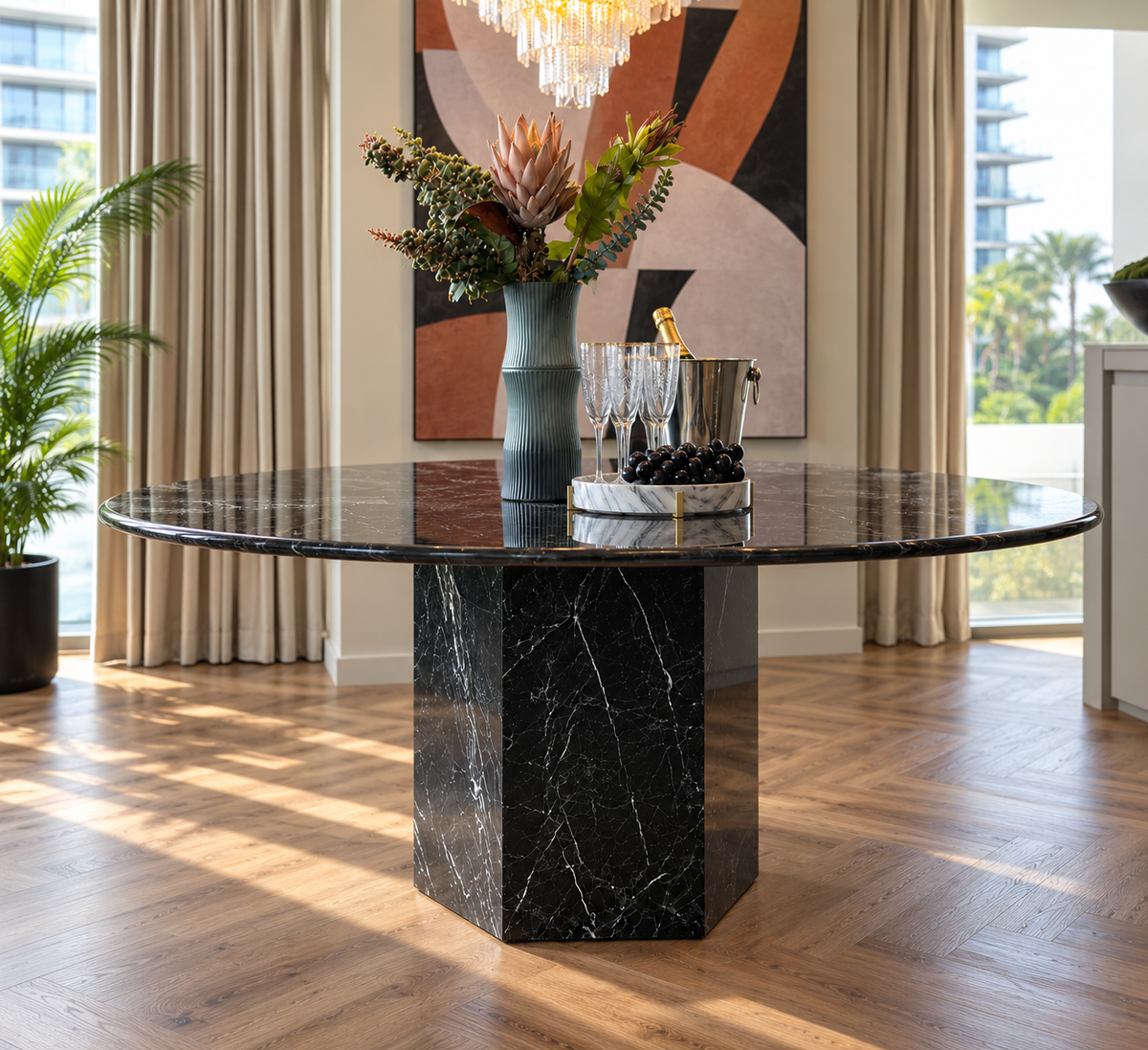 Epico Black Marquina Marble Round Dining Table with hexagonal pedestal base in a luxury Dubai interior