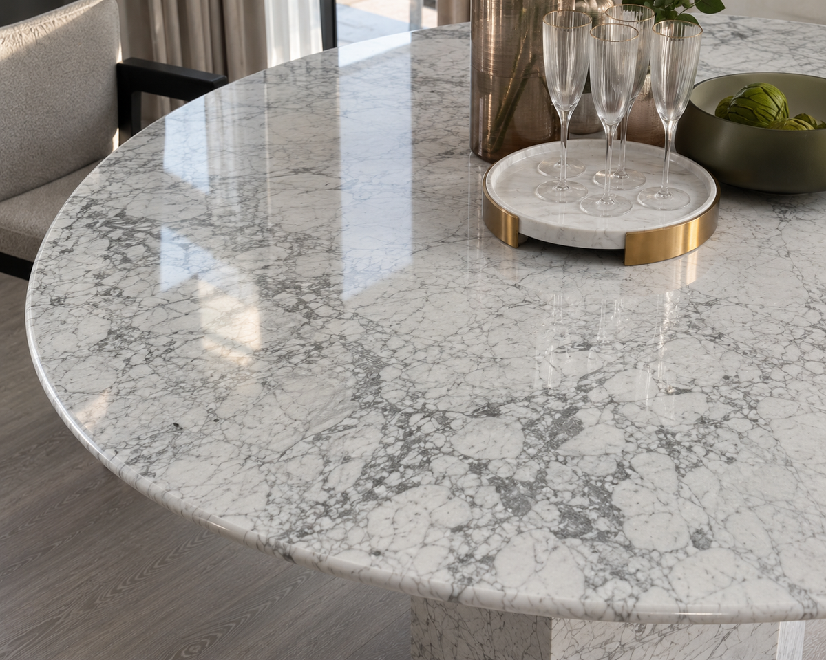 Close-up of the grey veining on the Epico white Carrara marble round table top