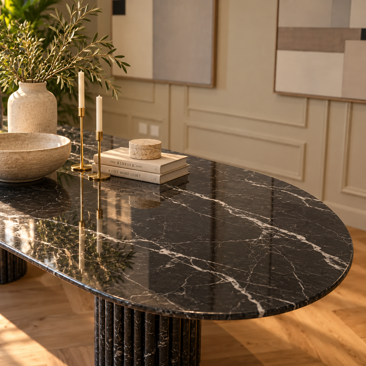 Close-up of the rounded end and white veining on the Impero Black Marquina marble oval table top