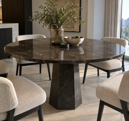 Lucia Saint Laurent marble round dining table with cream bouclé dining chairs in a dining room