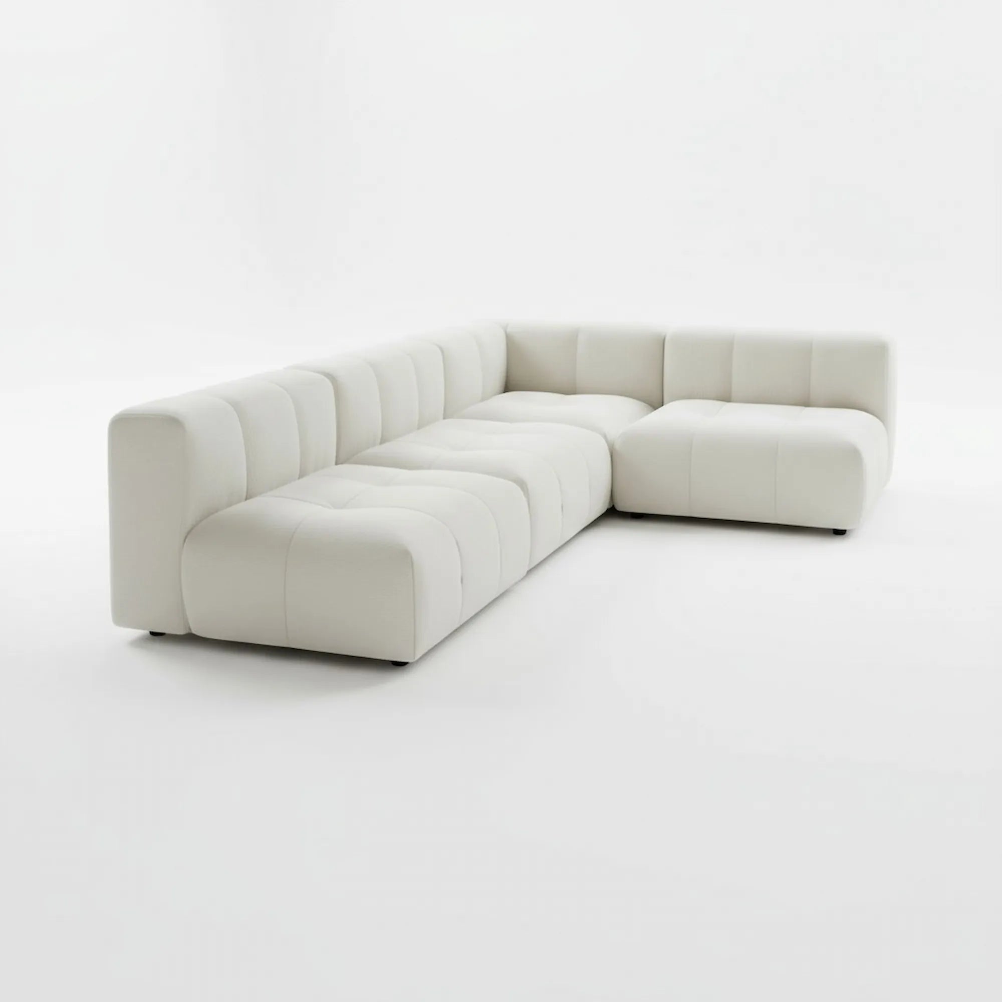 White sectional sofa on a white background by Casa Di ANdi Dubai