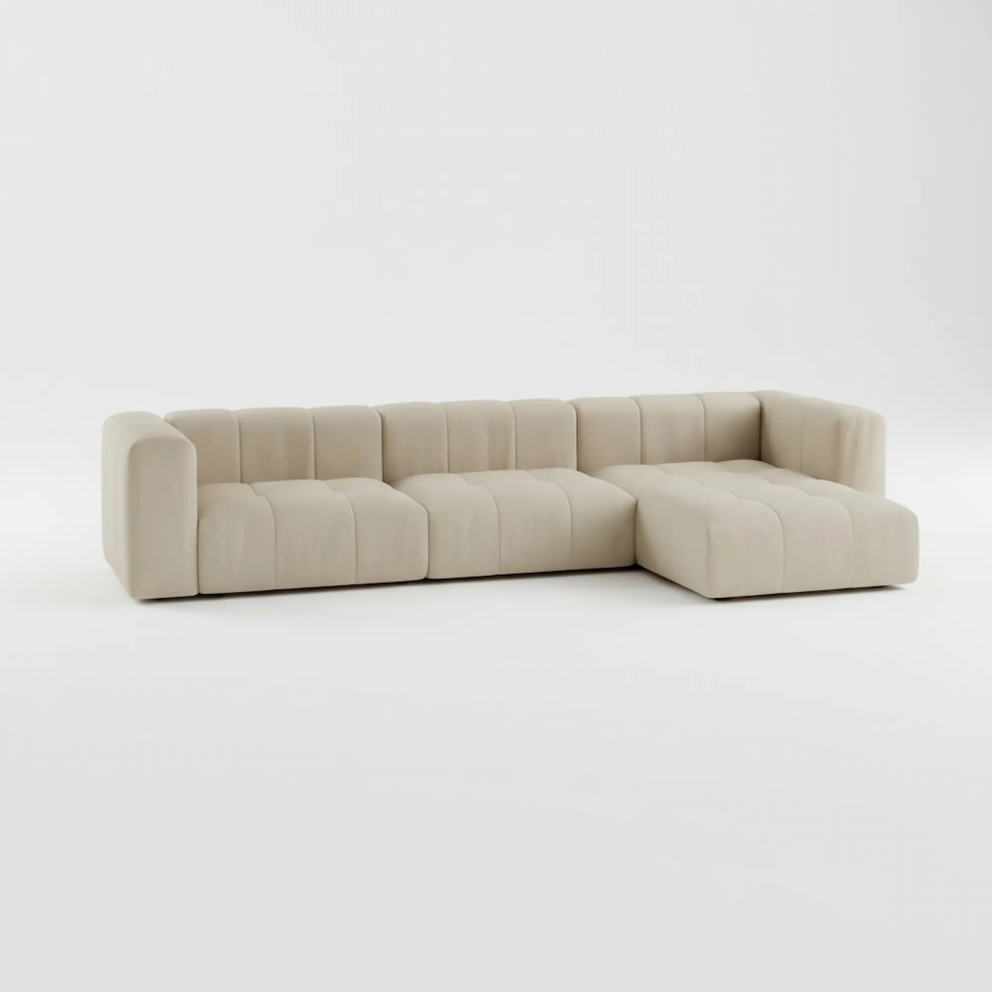 Modulo L-Shape Right Sofa in beige fabric — handcrafted modular design by Casa Di Andi, featuring deep seating and curved 1970s-inspired lines on a white background.