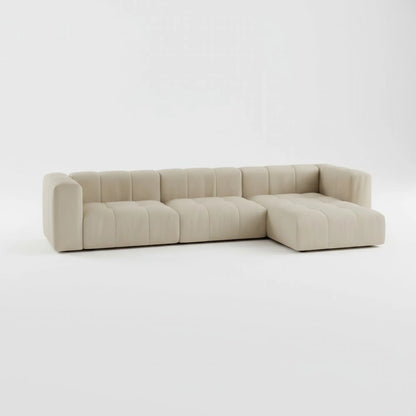 Modulo L-Shape Right Sofa in beige fabric — handcrafted modular design by Casa Di Andi, featuring deep seating and curved 1970s-inspired lines on a white background.
