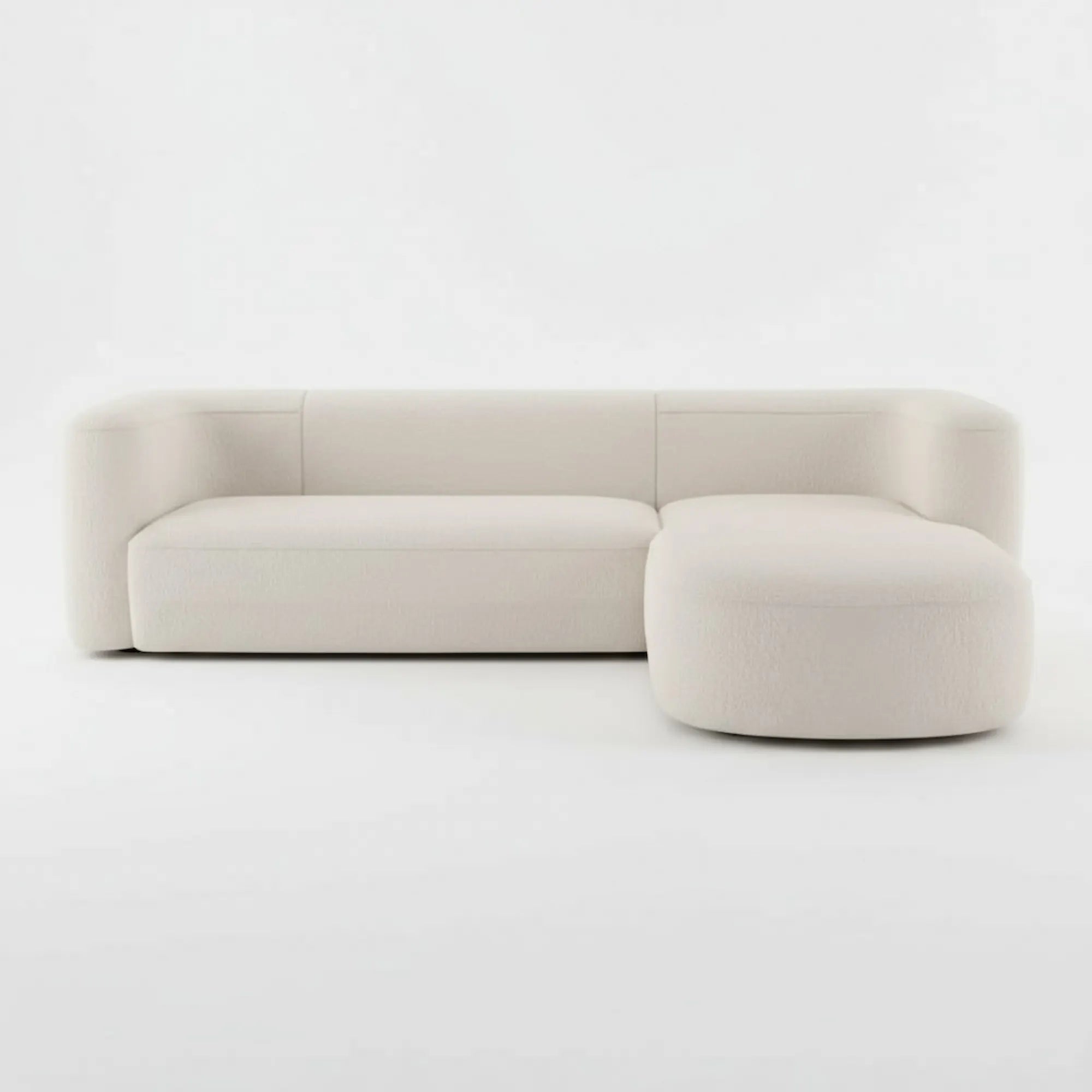 Onda L-Shape Right Modular Sofa in beige bouclé fabric on a white background — handcrafted curved design by Casa Di Andi Dubai.