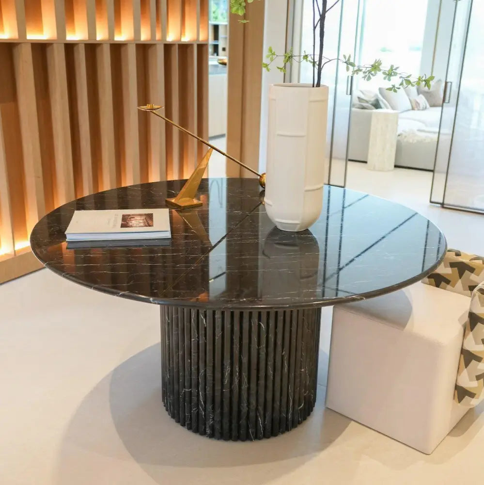 Dominio round dining table in Black Marquina marble with fluted base by Casa Di Andi Dubai