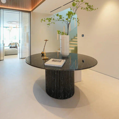 Dominio round dining table in Black Marquina marble with fluted base by Casa Di Andi Dubai