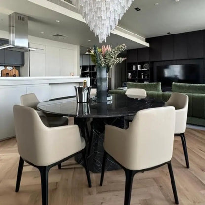 Black marble round dining table with sculptural base – Casa Di Andi Dubai