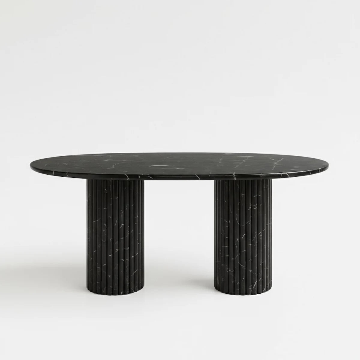 Black marble dining table with textured cylindrical legs on a white background Casa Di Andi Dubai